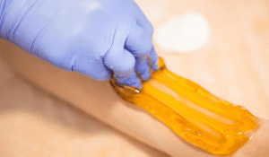 Professional organic sugaring hair removal technique at Sugar Fairy